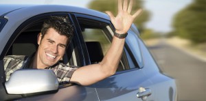 happy man waving from car window