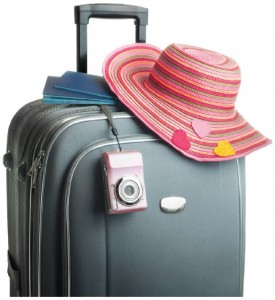 suitcase with hat and camera