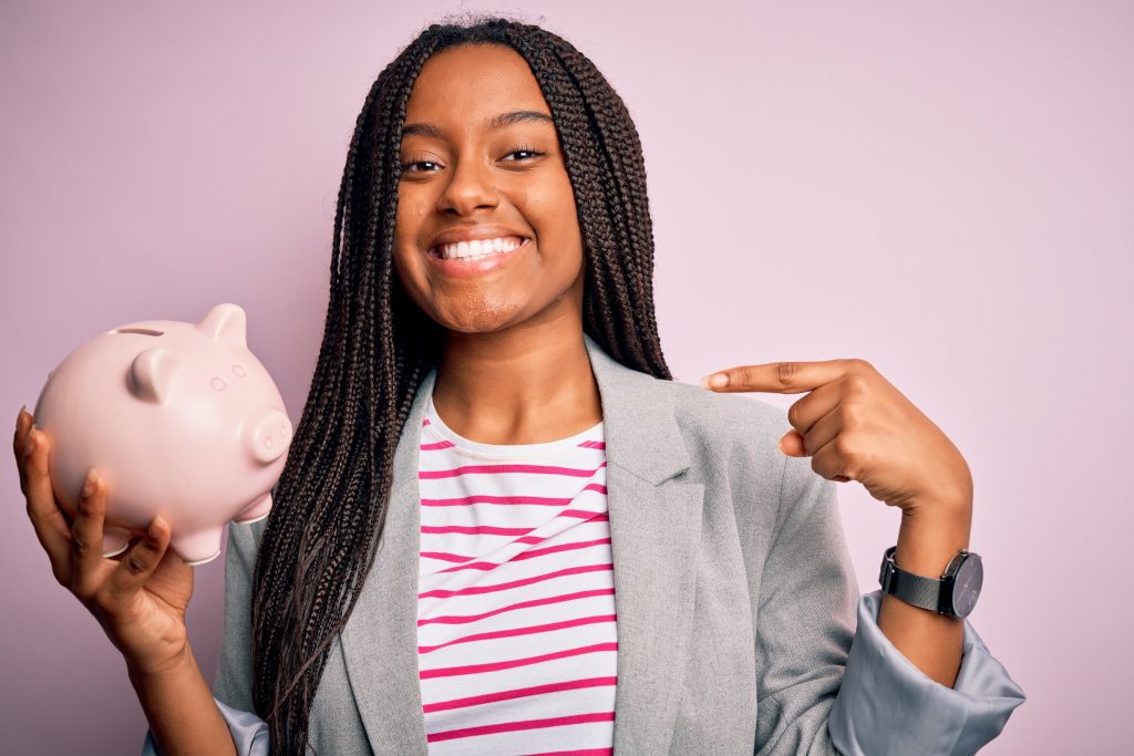 young girl with piggy bank