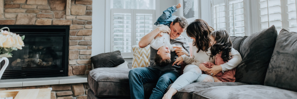family on a couch, at home, having fun